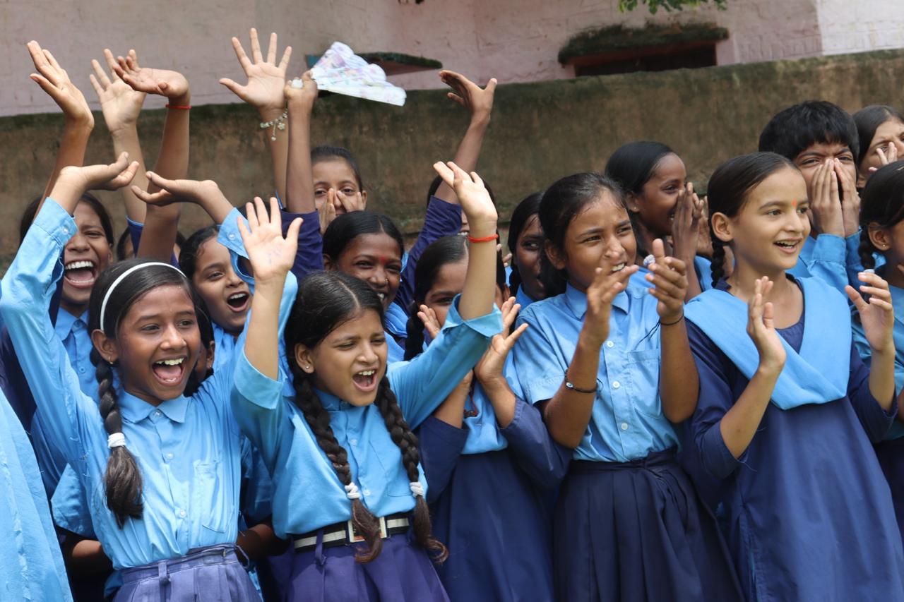 Schoolgirls celebrating together
