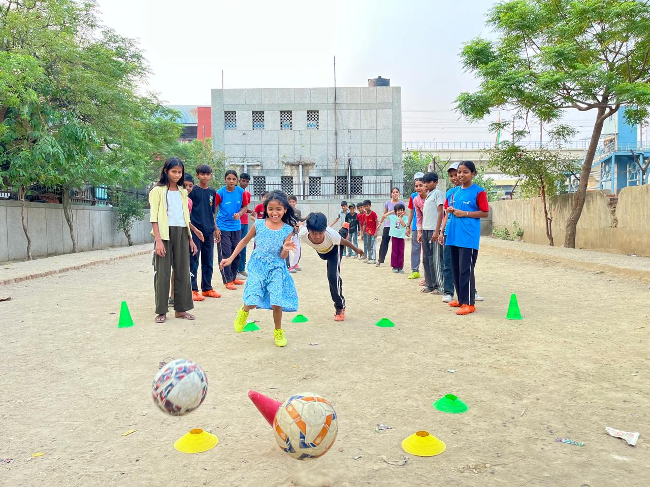 Children taking part in a structured football activity